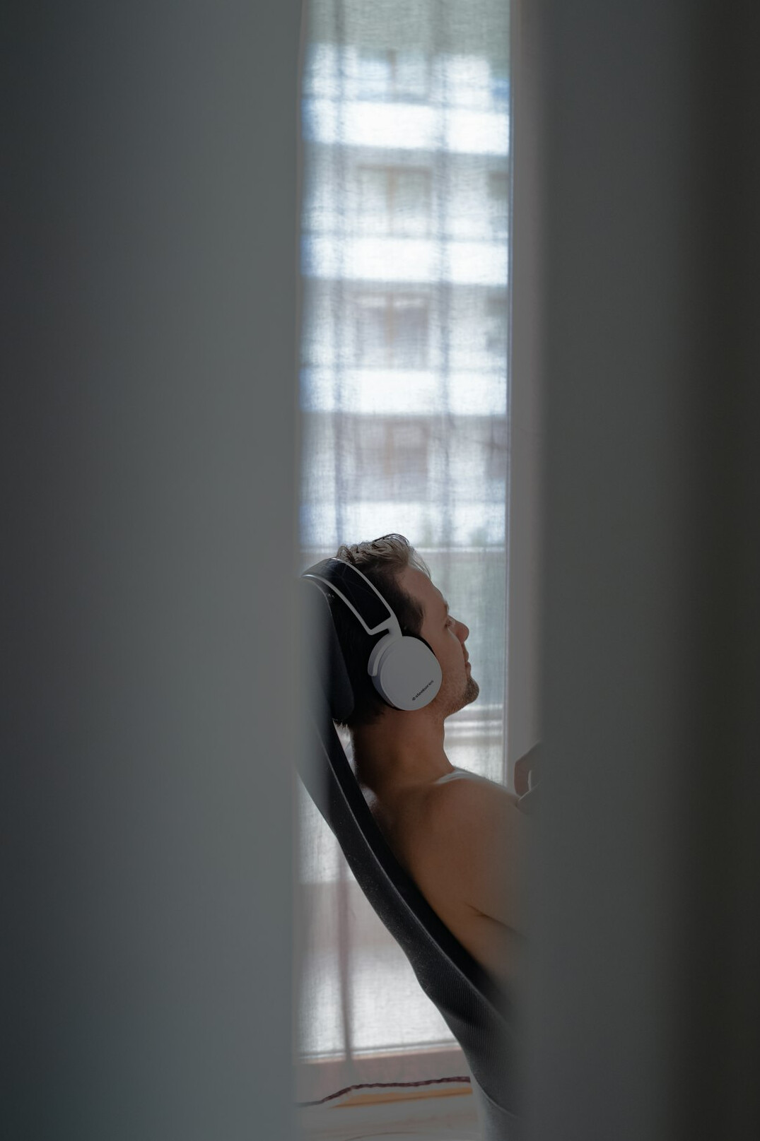 Woman wearing a headset working at a computer workstation